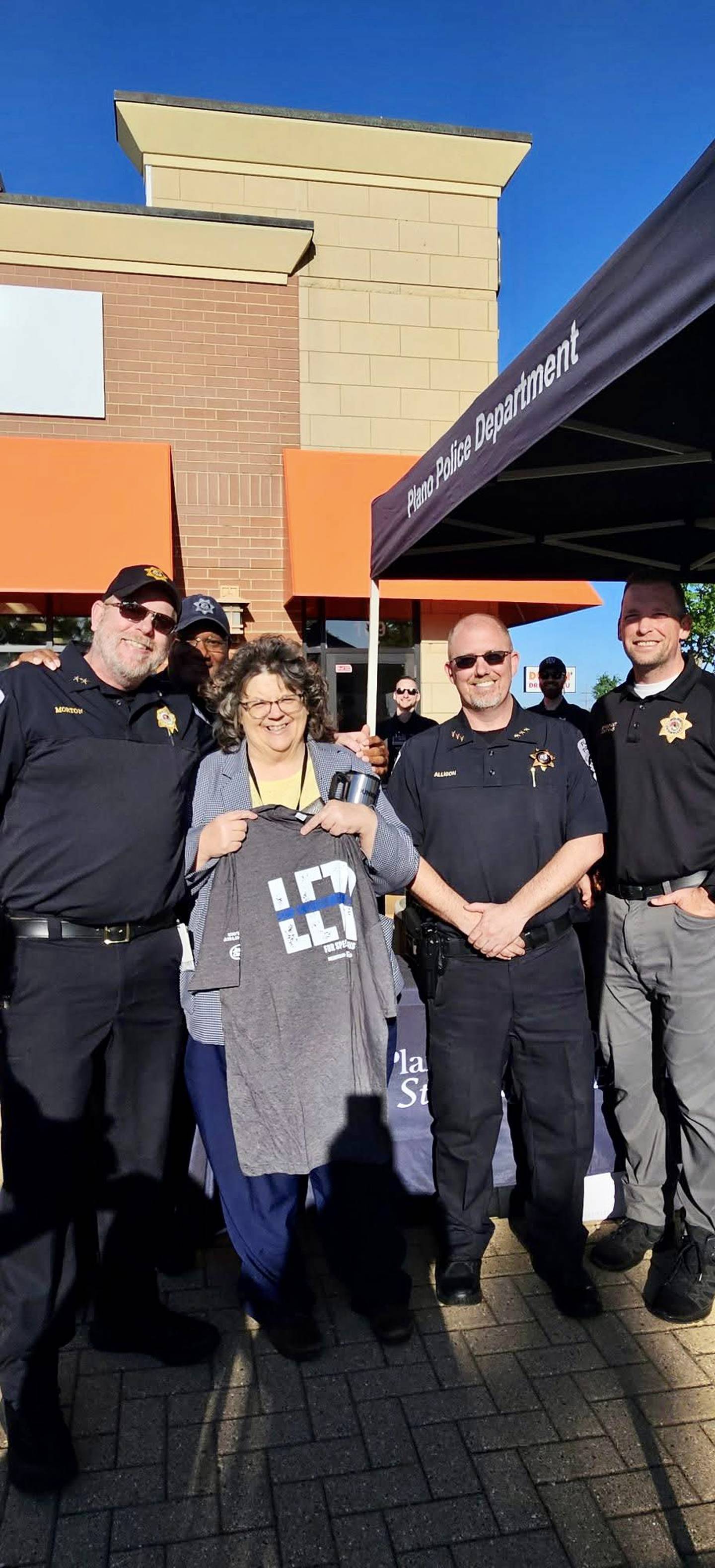 The Plano Police Department helped raise funds a met with community members at their 'Cop on a Rooftop' fundraiser at the Dunkin' in Plano.