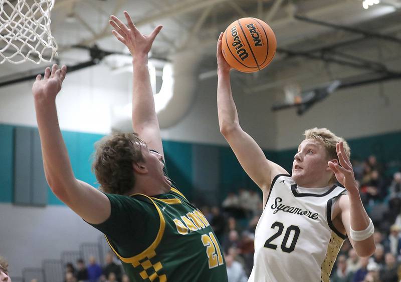 Sycamore's Isaiah Feuerbach drives to the basket against Crystal Lake South's Ryan Morgan during an IHSA Class 3A Woodstock North Sectional semifinal.basketball game on Wednesday, March 4, 2025, at Woodstock North High School.