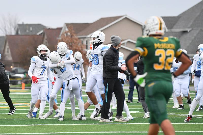 DePaul players rush to celebrate their victory on Saturday, Nov. 23, 2024, as the Rams beat Coal City 21-14 in the IHSA Class 4A Playoffs semifinal game.