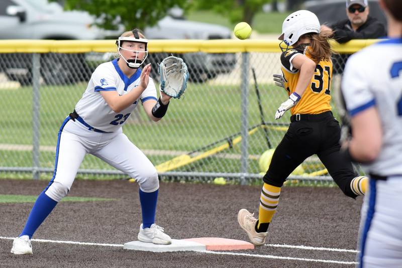 Peotone's Adyson Kosmos, left, fields a throw at first base as Herscher's Mikaela Vadeboncouer legs out a bunt single during a Class 2A Manteno Regional quarterfinal at Herscher Monday, May 18, 2026.