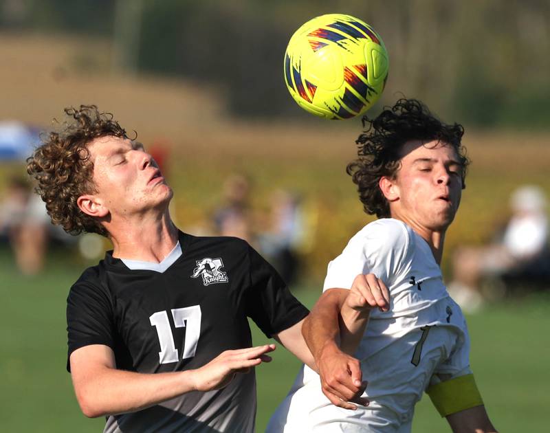 Kaneland's Elijah Stoltzner (left) and Sycamore's Noah Daykin try to win the ball during their game Wednesday, Sept. 16, 2025, at Kaneland High School in Maple Park.