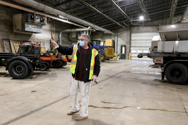 Village of Algonquin Public Works General Services Superintendent Steven Ludwig gestures toward some of the vehicles currently occupying the facility on Wednesday, Nov. 25, 2020 in Algonquin.  The facility, located at 110 Meyer Dr., could potentially become a COVID-19 vaccine distribution site with ample room indoors to accommodate multiple workplaces for health department staff to collect information and administer a vaccine.  Vehicles currently residing inside the structure will be relocated outside if necessary.