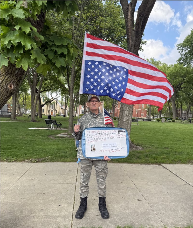 Michael Angelico, an Ottawa resident, participating in Friday night's "May Day Rally" at Washington Square Park in Ottawa.