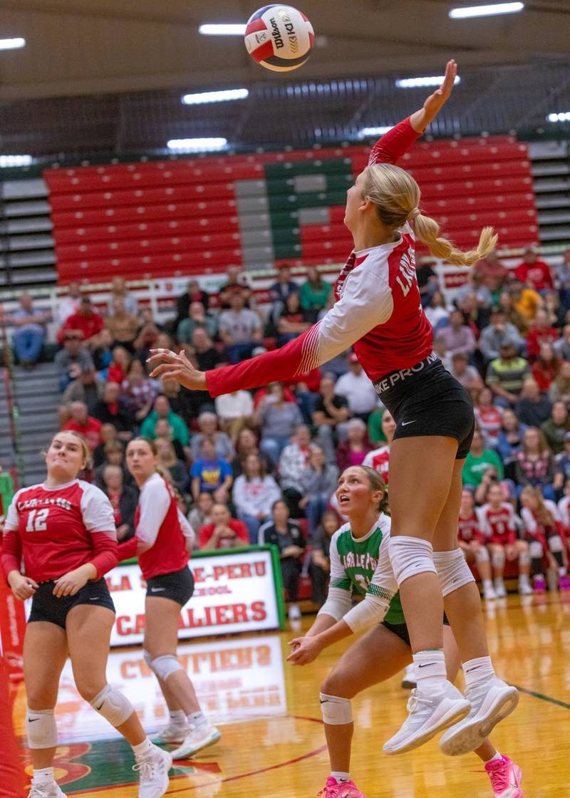 Kelsey Frederick spikes the ball against Ottawa High School during the match at Sellett Gym on Oct. 15, 2025 at LaSalle-Peru High School.