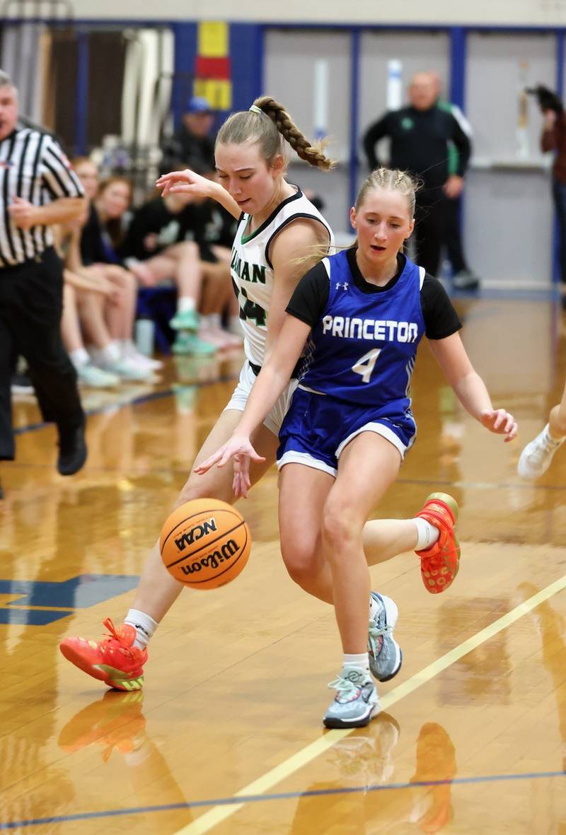 Princeton senior Paige Jesse battles Alleman's Carson Wendt for the ball during Thursday's regional championship game at Prouty Gym. The Pioneers repeated as regional champions with a 40-27 win.