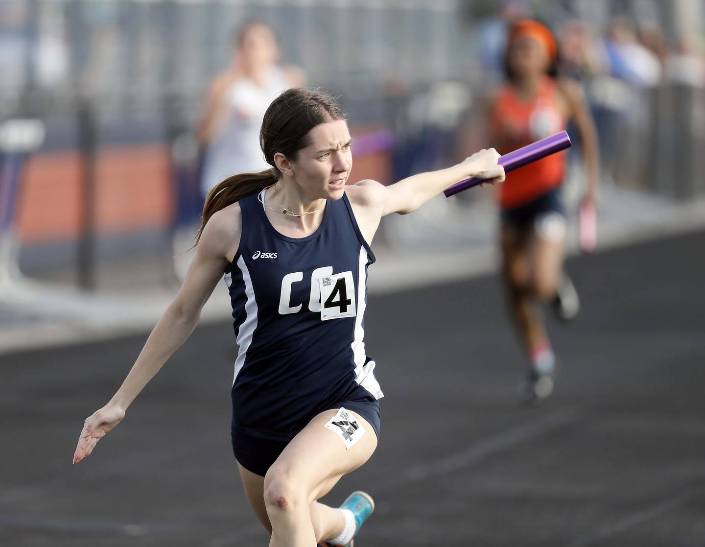 Kate Aniolkowski of Cary Grove takes first for you team in the Girls 4x100 relay during the 2023 Gus Scott Invitational Friday April 14, at Naperville North High School.