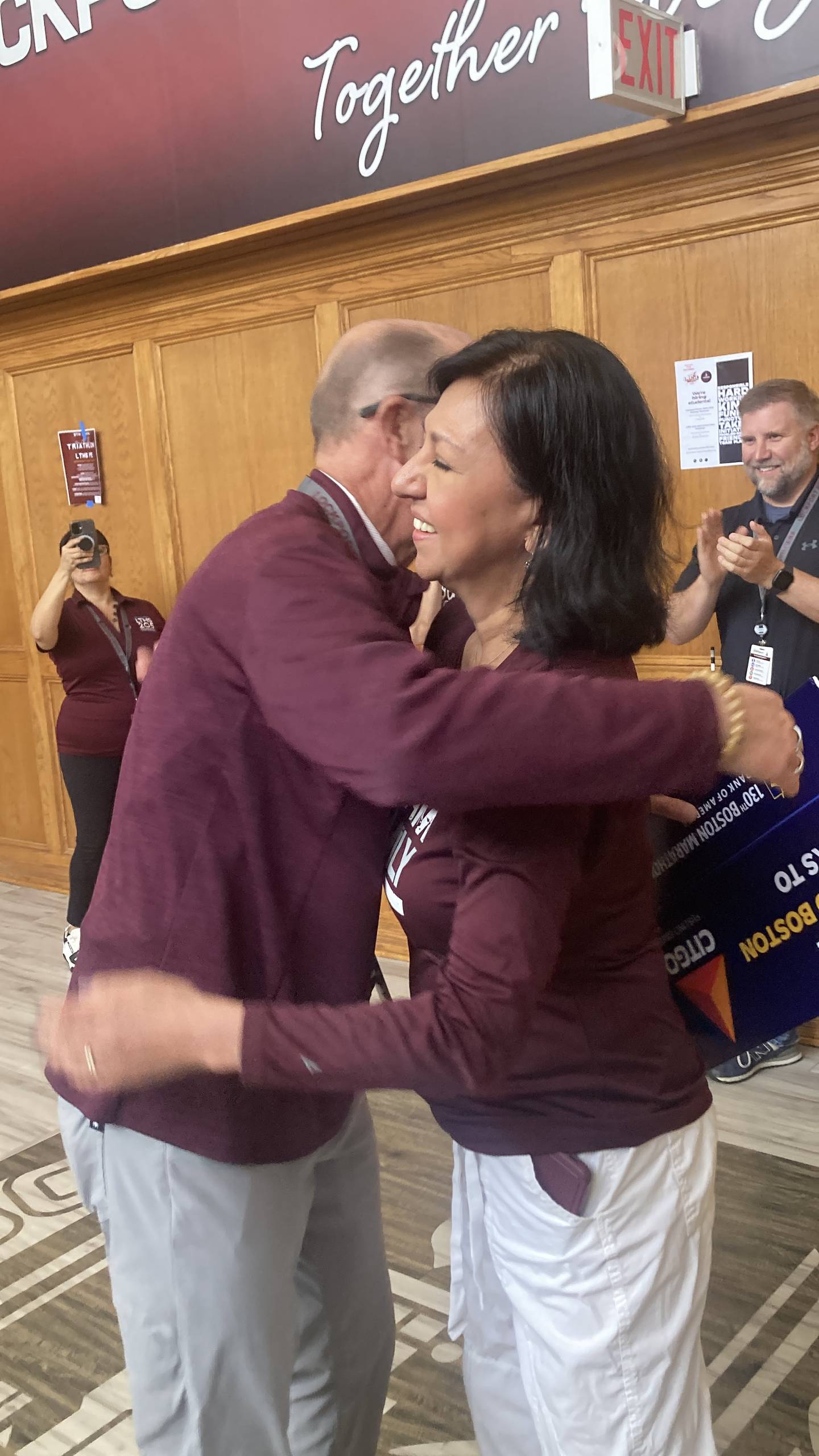 District 205 Superintendent Dr. Robert McBride hugs Board of Education Vice President Ann Lopez-Caneva at a surprise send-off celebration Friday, April 17, 2026.