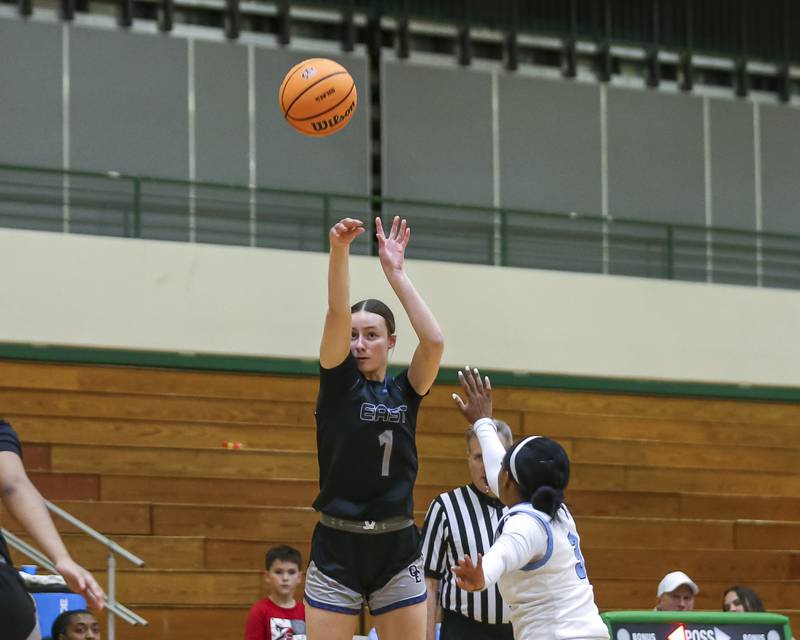 Oswego East's Aubrey Lamberti (1) shoots a jump shot during their York Thanksgiving Tournament matchup between Oswego East at Downers Grove South Friday, Nov 20, 2025 in Elmhurst.