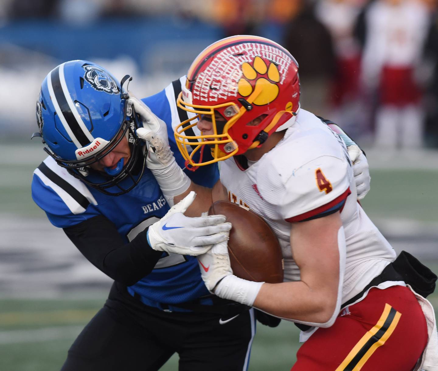 Joe Lewnard/jlewnard@dailyherald.com
Batavia’s Charlie Whelpley, right, tries to break a tackle by Lake Zurich’s Nathan Breeman during the Class 7A football semifinal in Lake Zurich Saturday.