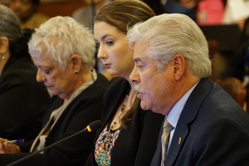 Rep. Fred Crespo, right, and Bridget Peach, executive director of the advocacy group ED-RED, testify in favor of special funding for the education of migrant students during a House committee hearing Tuesday, April 16, 2024.