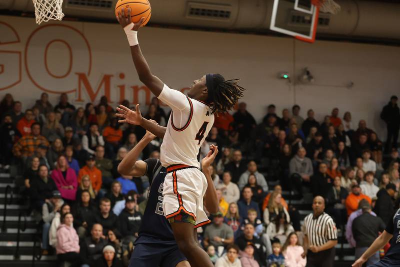 Minooka’s Nehemiah Brown lays in a shot against Oswego East on Friday, Jan. 16, 2026 in Minooka.
