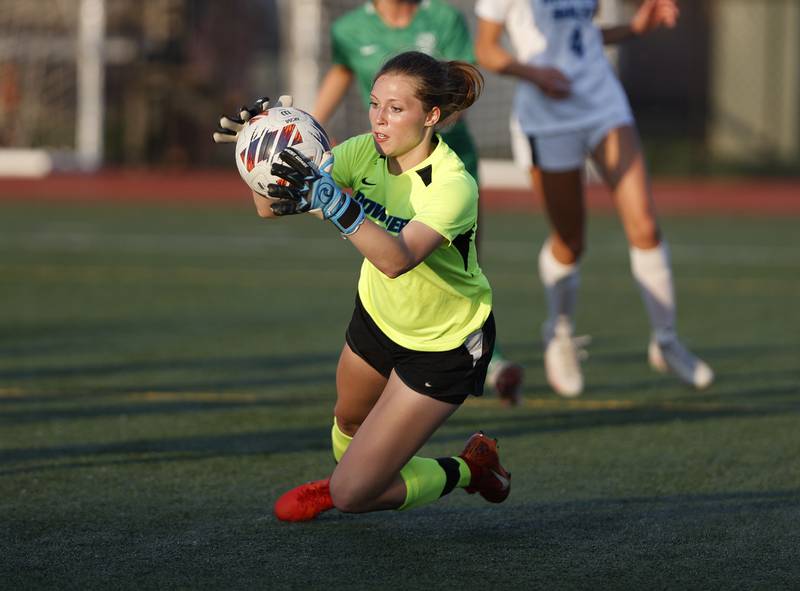Downers Grove South's Delia Whaley (0) makes a save against York during the Class 3A Morton regional girls soccer final between Downers Grove South and York in Berwyn on Friday, May 17, 2024.