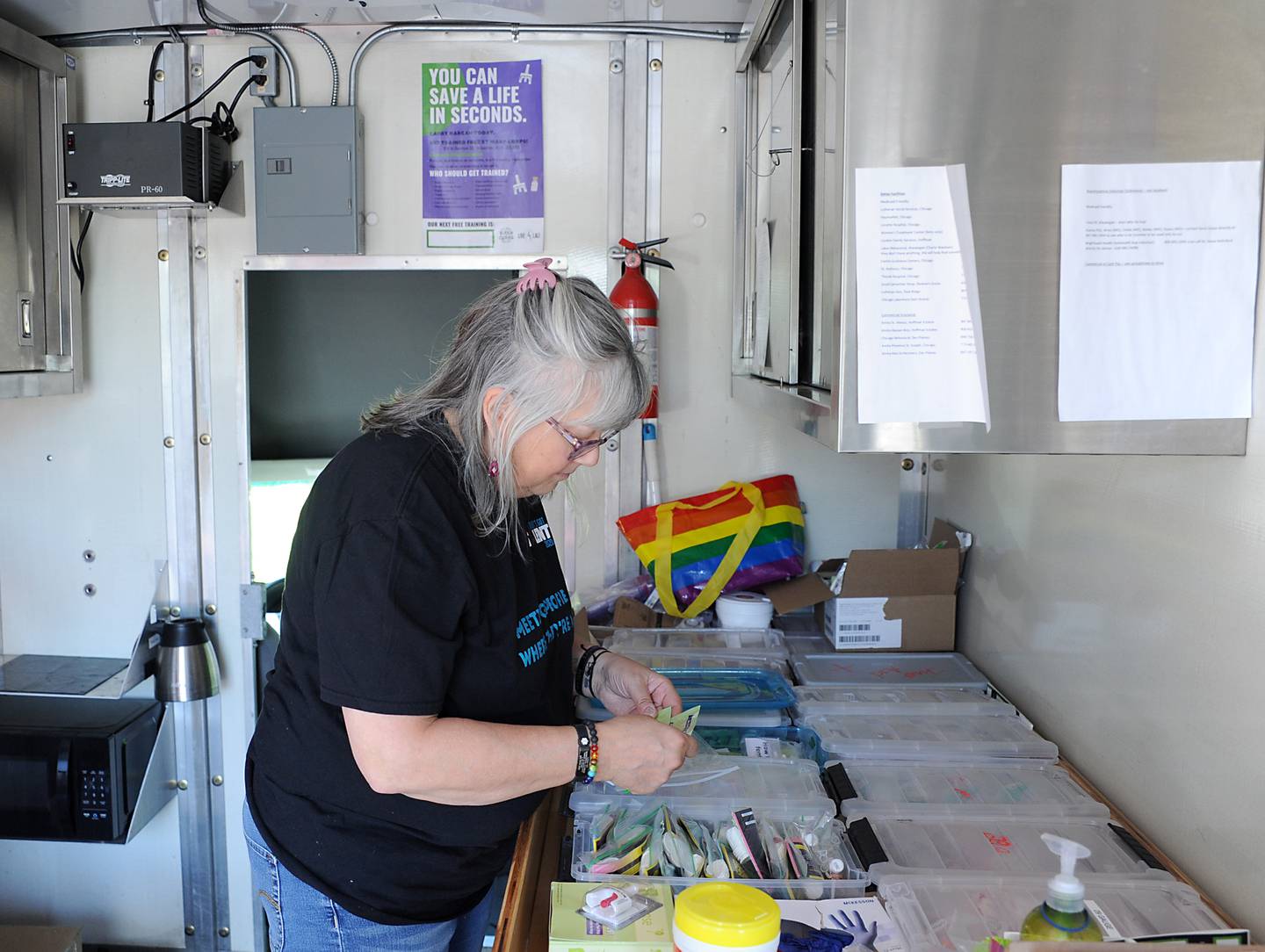 Laura Fry, the executive director of Live4Lali, checks the supplies on the nonprofit's truck before a meeting Monday, June 27, 2022, of the McHenry County Substance Abuse Coalition in Crystal Lake. Live4Lali is one of nearly 60 agencies being asked how McHenry County should spend the Big Pharma settlement in battling opioid addiction in McHenry County.