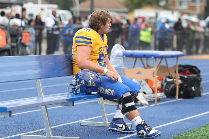 Joliet Central’s Harrison Majerus sits on the bench in frustration in the final minutes of the half down 25-0 against Joliet West on Saturday, Sept. 28, 2024 in Joliet.