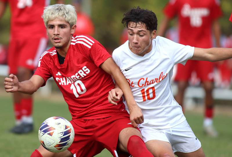 Dundee-Crown’s Sebastian Sanchez, left, battles St. Charles East’s Huxley Kapoor in IHSA Class 3A Regional Championship soccer at Dundee-Crown High School in Carpentersville on Saturday, October 25, 2025.