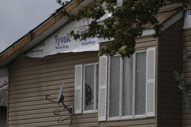 A damaged apartment building in Huntley on Thursday, July 13, 2023, after a confirmed tornado took the roof off the building in Huntley on Wednesday.