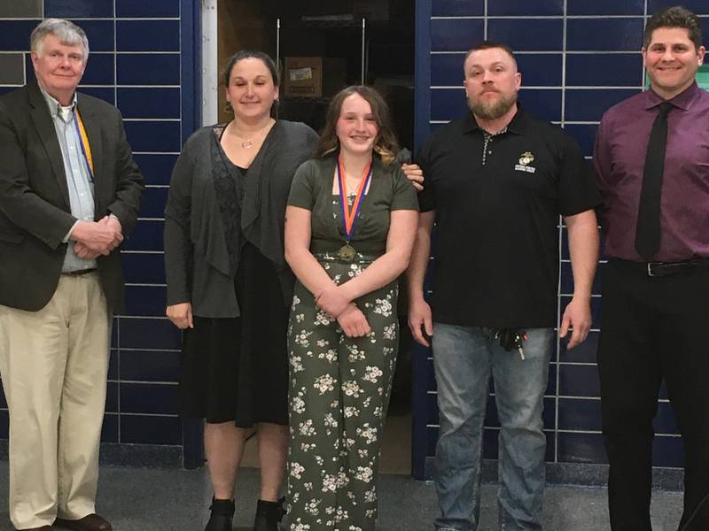 Pictured (left to right): Lion President Robert Becker Jr., Renee Paustian, 7th grader Zabella Paustian, Chadd Paustian, and Genoa-Kingston Middle School Principal Craig Butcher