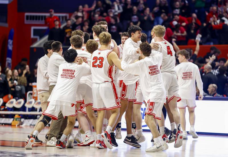 Deerfield celebrates their victory over Kaneland in the IHSA Class 3A boys basketball state semifinal Friday, March 13, 2026 at the State Farm Center in Champaign.