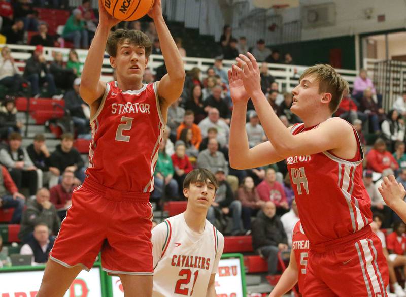 Streator's Matt Williamson grabs a rebound in front of L-P's Wyatt Kilday as teammate Nolan Lukach (right) block the lane on Tuesday, Jan. 14, 2025 in Sellett Gymnasium at L-P High School.