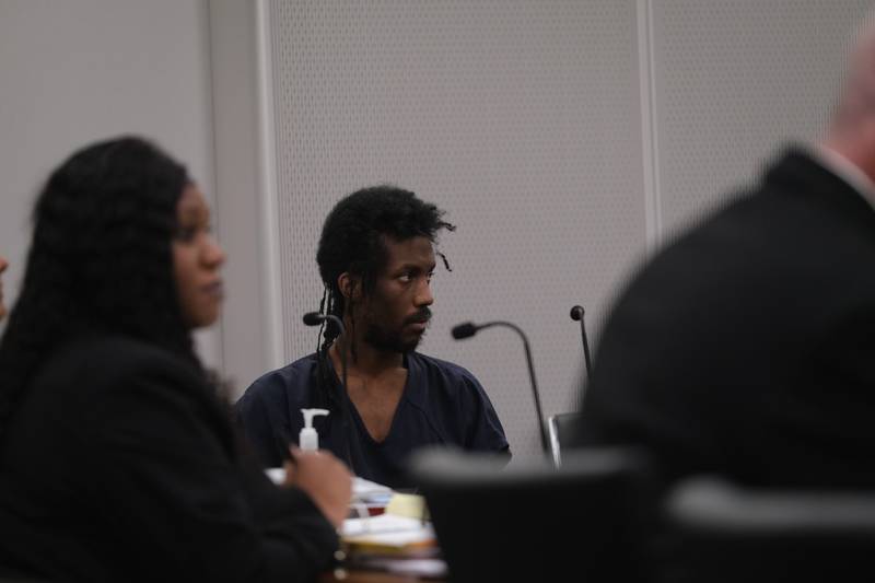 Robert Watson, 29, sits with his attorneys on Wednesday, May 3, 2023, at the Will County Courthouse in Joliet.