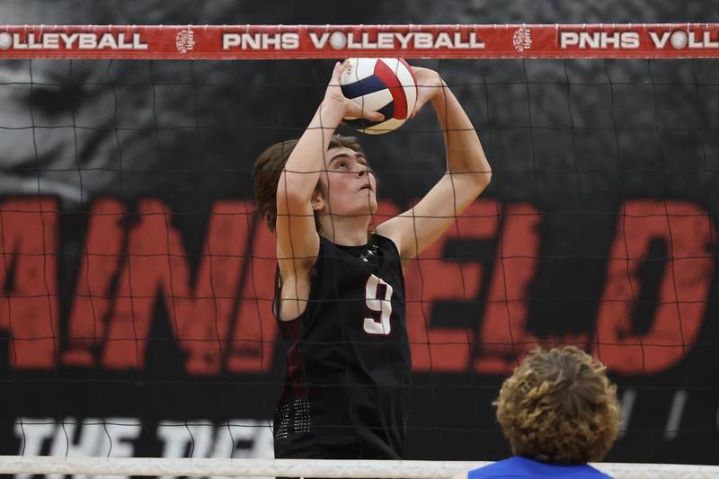 Plainfield North’s Easton Isaacson sets the ball against Lincoln-Way East on Tuesday, April 2, 2024.