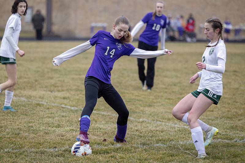 Dixon’s Maggie Van Sickle works against Alleman’s Lindsey Britton Thursday, March 16, 2023.