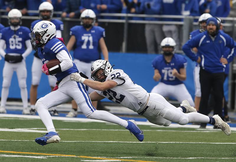 Geneva’s Bennett Konkey is tackled by Cary-Grove's Michael Dunkin during an IHSA Class 6A semifinal football game on Saturday, Nov. 23, 2024, at Geneva High School.