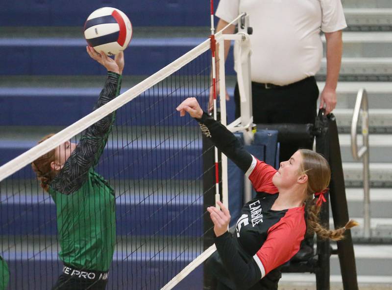 Leland's Izzy Podnar blocks a spike from Earlville's Audrey Scherer during the Class 1A Regional semifinals on Monday, Oct. 27, 2025 at Somonauk High School.