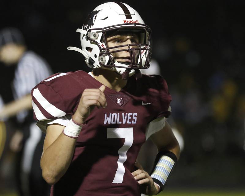 Prairie Ridge's Tyler Vasey talks to his coach, Chris Schremp during a Fox Valley Conference football game between Jacobs and Prairie Ridge Friday, Sept. 16, 2022, at Jacobs High School in Algonquin.