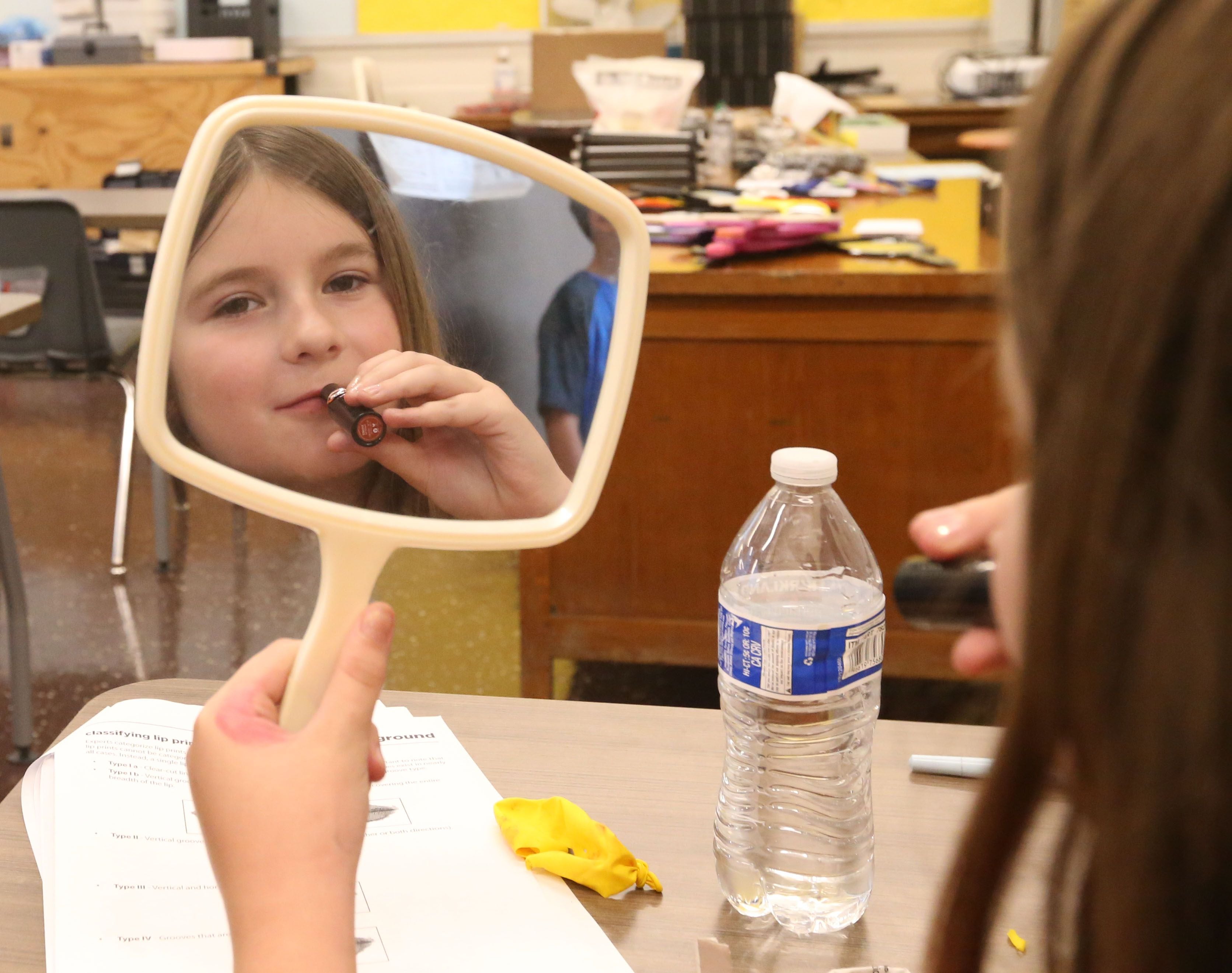 Ciara Schlenz uses lip stick to study forensics during the Area Career Center's Summer Hands-On Showcase on Thursday, June 8, 2023, at La Salle-Peru High School. 