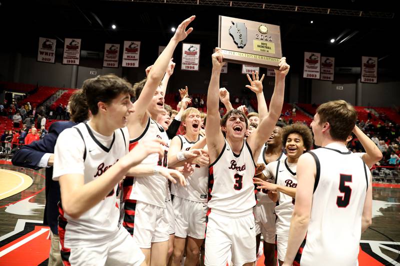 Benet’s Brady Kunka hoists the plaque following their Class 4A NIU Supersectional win against Rockford Auburn in DeKalb on Monday, March 6, 2023.