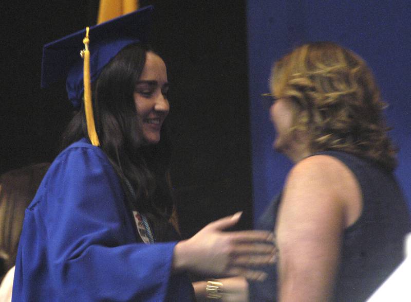 Lauren Francque talks with Jennifer Oetting after receiving her diploma. The Newman High School Class of 2026 Commencement Ceremony was held on Wednesday, May 20, 2026, at Newman Central Catholic High School. in Sterling.