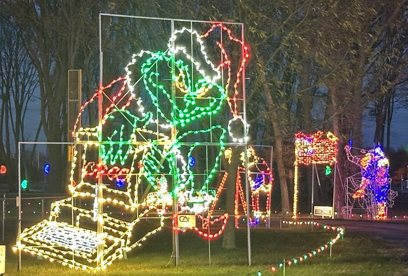A large display of the Grinch welcomes visitors during Celebration of Lights display on Monday, Nov. 10, 2025 at Rotary Park in La Salle.