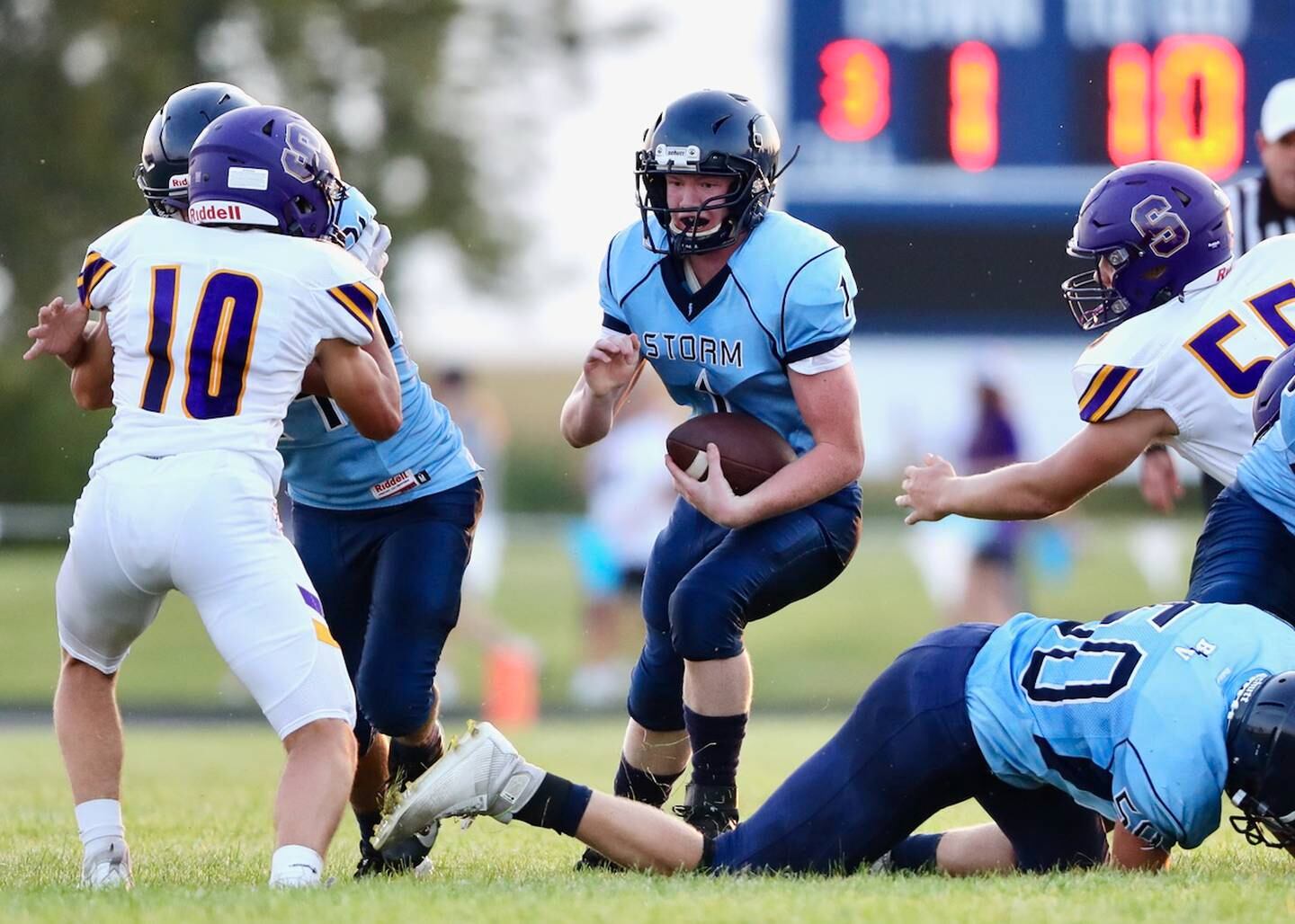 Bureau Valley quarterback Bryce Helms looks for running room Friday night against Sherrard