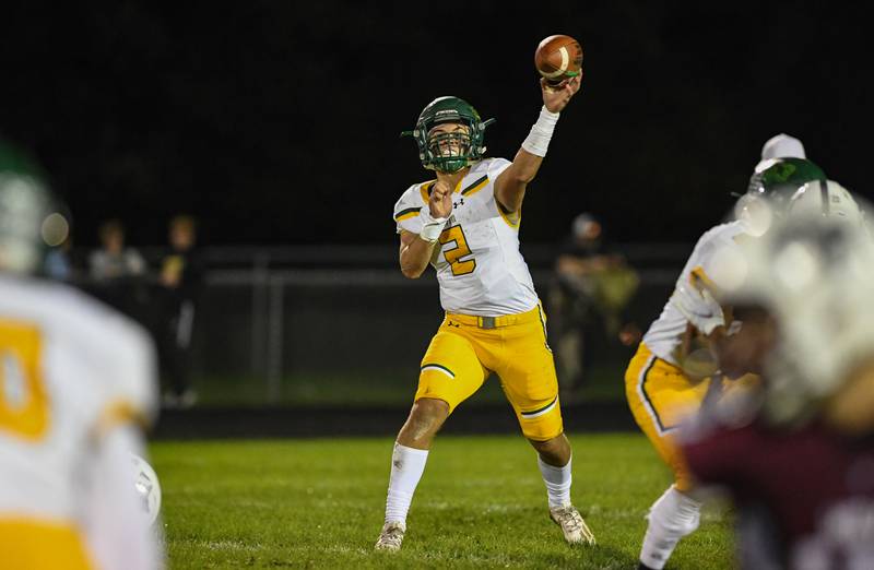 Crystal Lake South quarterback Justin Kowalak throws to a receiver downfield during Friday night's football game against Prairie Ridge at Prairie Ridge High School on October 15, 2021 in Crystal Lake, IL.