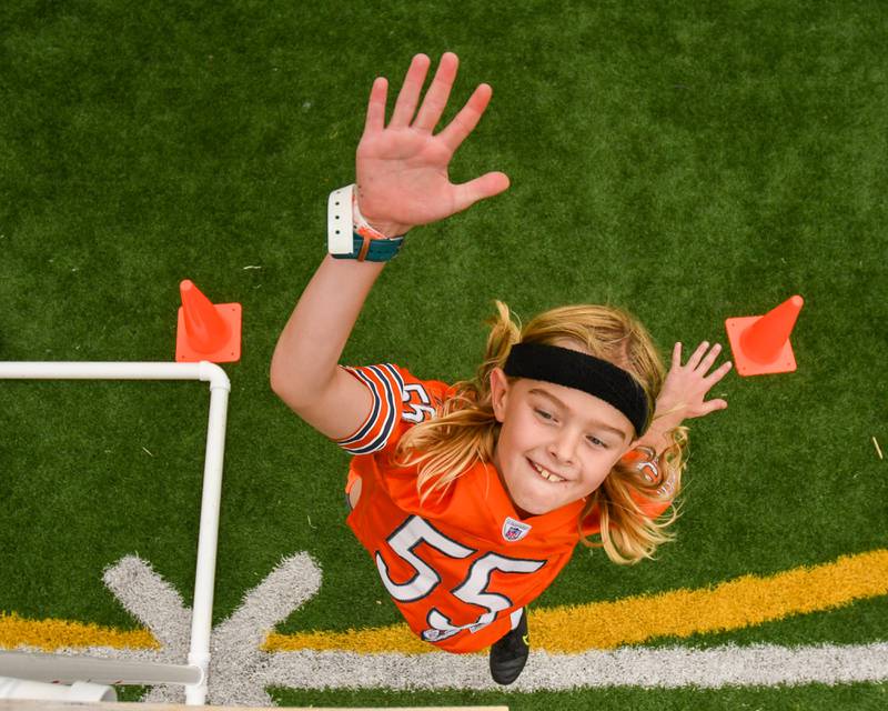 Brayden Briggs, 9, of Downers Grove sees how high he can get in the standing vertical jump portion of the NFL Youth Flag Football Combine Day held at Doerhoefer Park in Downers Grove on Sunday Aug. 6, 2023.