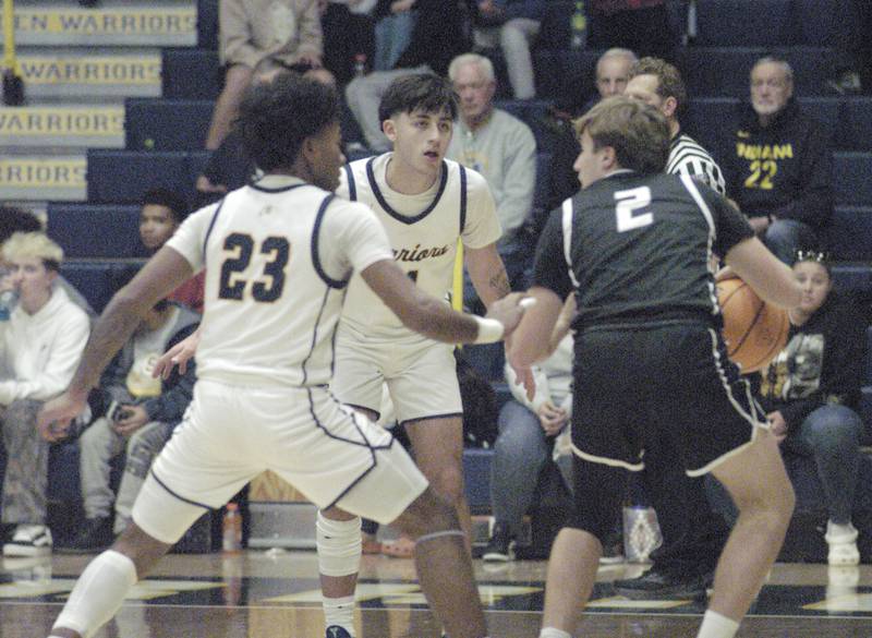 Sterling players Kaedon Philips and Nico Battagliablock the path of Galesburg's Jackson Crocksibbing. Sterling Boys Basketball hosted Galesburg at Musgrove Fieldhouse on February 11, 2025.