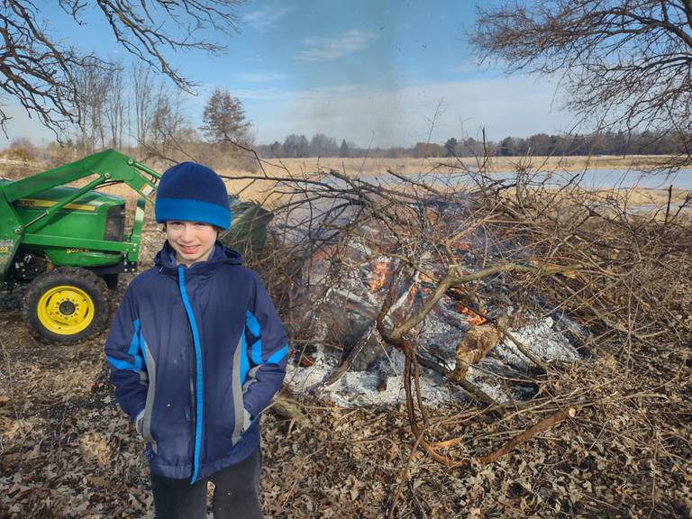 Staff and volunteers with the Land Conservancy of McHenry County, including 9-year-old Kennett Ducci, shown here, "rescue" two oaks in Harvard Saturday morning, Dec. 31, 2022, as part of their annual New Year's Eve Oak Rescue in an attempt to preserve the native tree species around the county.