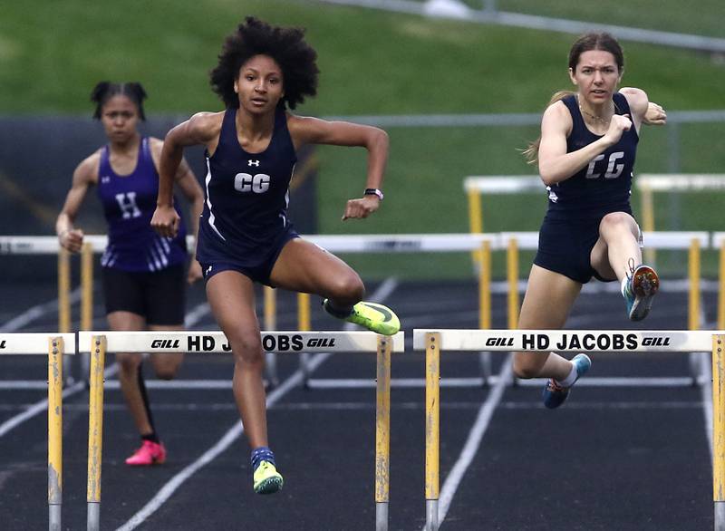 Cary-Groves Olivia Parker and Kate Aniolkowski race against each other in the 300 meter hurdles on Thursday, May 2, 2024, during the Fox Valley Conference Girls Track and Field Meet at Jacobs High School in Algonquin.