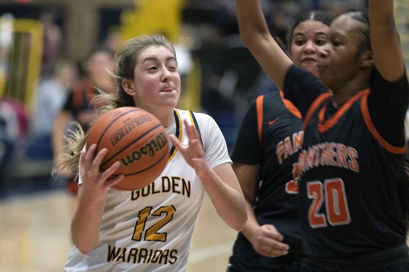 Sterling’s Olivia Melcher drives to the hoop against United Township Thursday, Jan. 19, 2023.