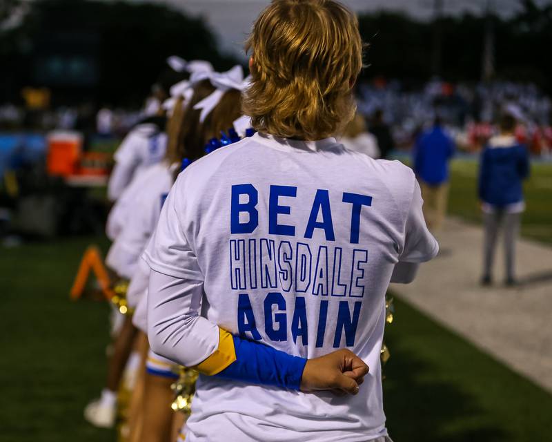 The Lyons cheer squad stands for the playing of the national anthem before during football game between Hinsdale Central at Lyons.  Sept 8, 2023.