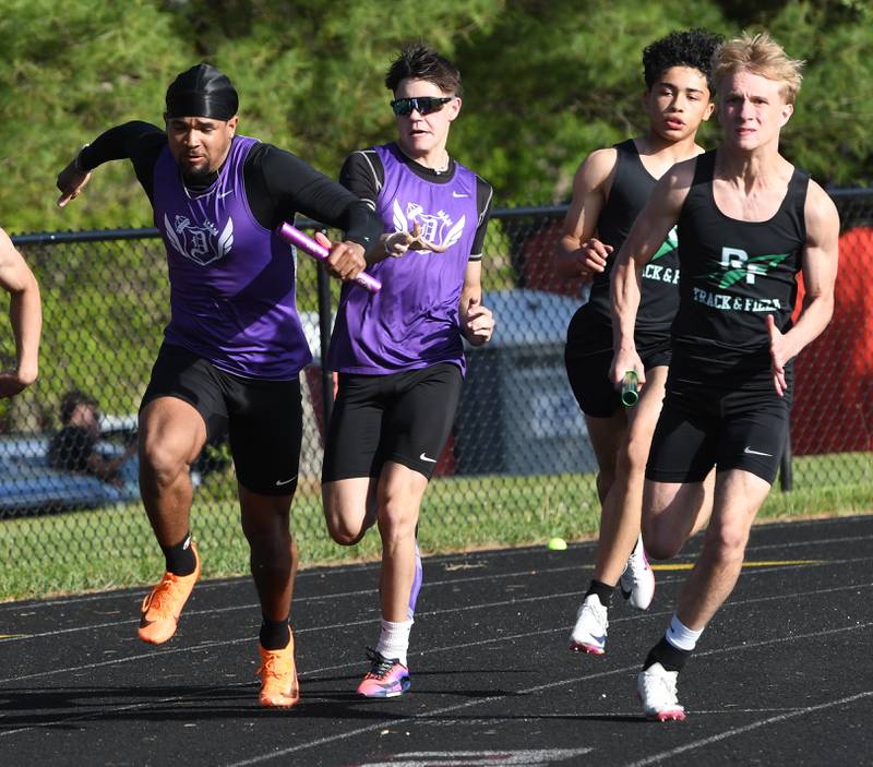 Dixon's Noah Flynn hands the baton to Quintynn Sarver and Rock Falls Alexavier Oquendo hands off to Logan Thome in the first exchange of the 4x100 relay elay at the Big Northern Conference Meet at Stillman Valley on Thursday, May 14, 2026.