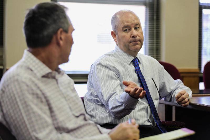 Lincoln-Way High School District 210 Assistant Superintendent Bradley Cauffman (left) and Superintendent Scott Tingley speak Tuesday about the district's financial health at Lincoln-Way Central High School in New Lenox.