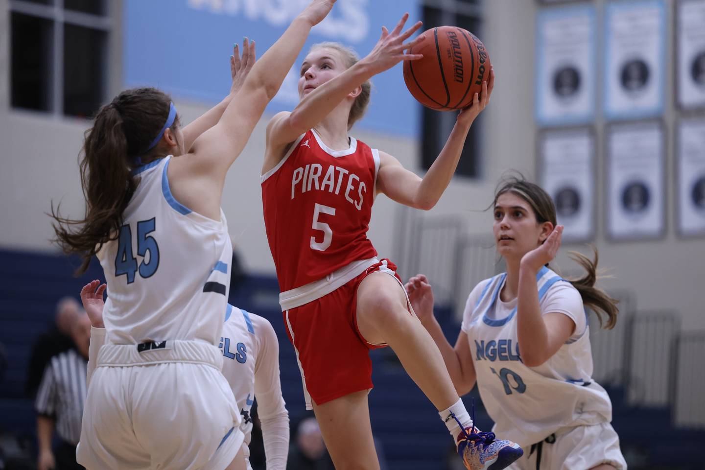 Ottawa’s Grace Carroll goes in for the basket against Joliet Catholic.