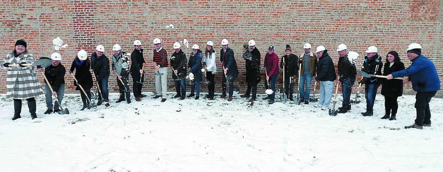 Nearly two-dozen individuals shovel snow and dirt during a groundbreaking ceremony at the former Maytag building on  the corner first and Joliet streets downtown La Salle in January 2020. At the time, work began on the building with a projection to finish by the end of summer.