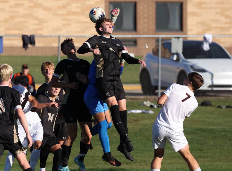 Sycamore's Tyler Hiland heads the ball away on a DeKalb corner kick during the El Classicorn rivalry game Tuesday, Oct. 7, 2025, at Sycamore High School.