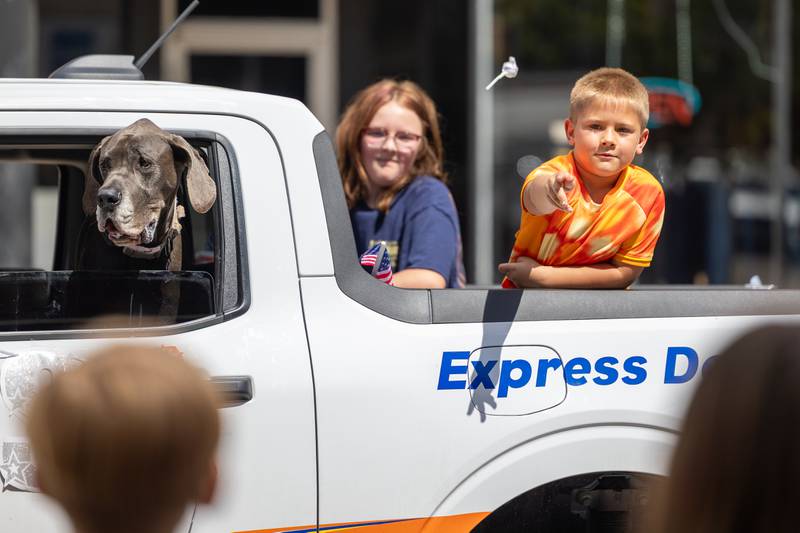 Charles Badger throws candy from truck on Sunday, Aug 31, 2025 at the Labor Day parade on Main Street in Streator.