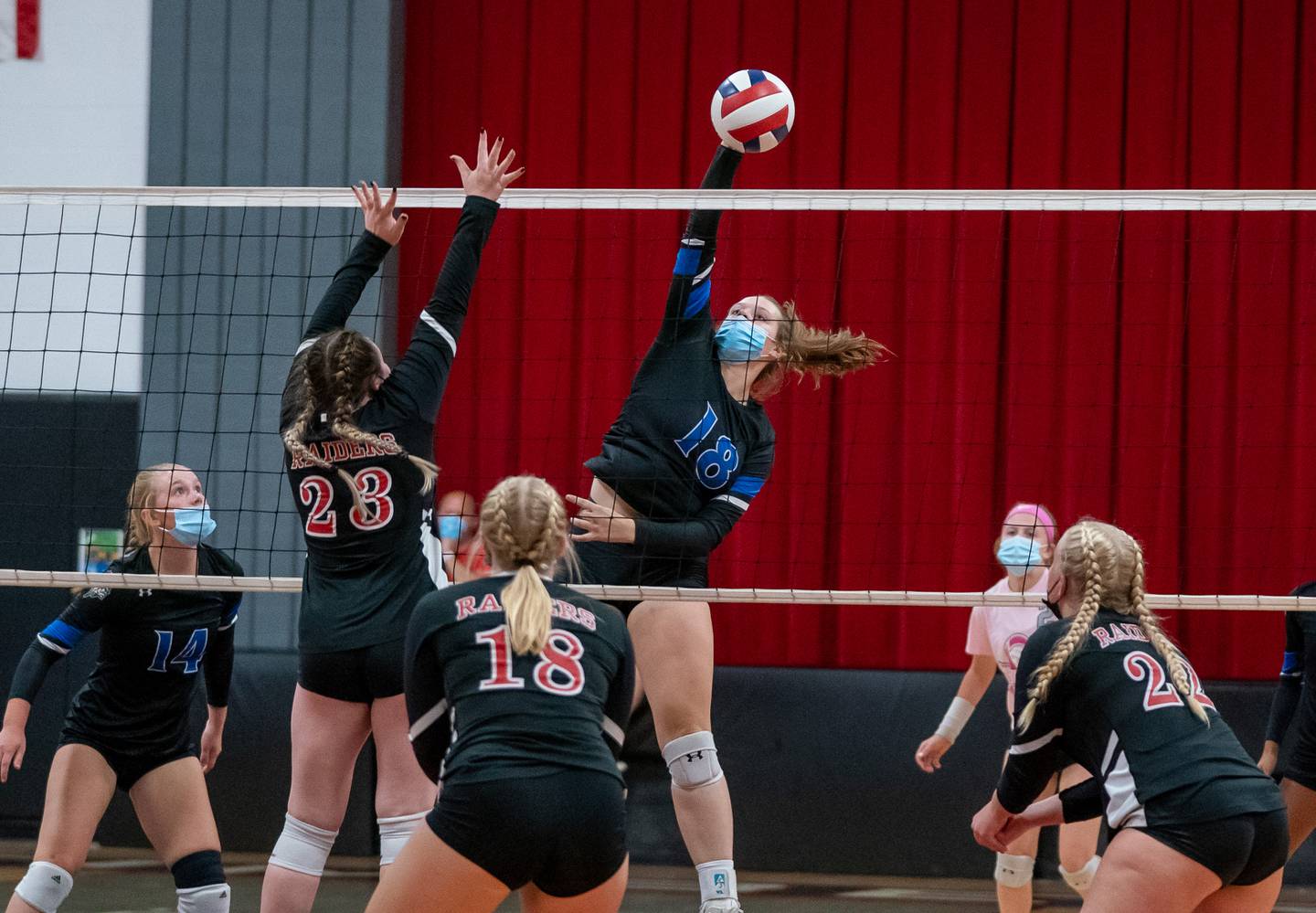 Newark’s KJ Friestad (18) goes up for a kill against Earlville's Alexis Olson (23) during a Little Ten Conference championship volleyball match at Indian Creek High School in Shabbona on Saturday, Oct 9, 2021.