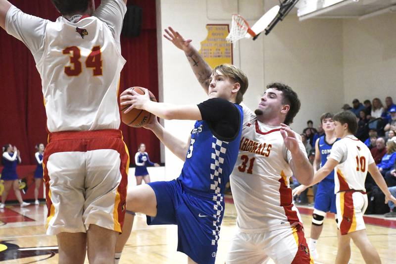 Clifton Central's Andrew Rohlwing goes up for a shot while contested by St. Anne's Brandon Schoth and Jason Bleyle during St. Anne's 61-56 victory over Clifton Central on Tuesday January 6, 2026.