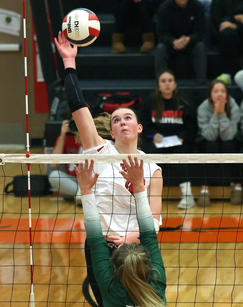 Huntley's Georgia Watson spikes the ball over Fremd’s Harper Neill Monday, Nov. 11, 2024, during their Class 4A supersectional match at DeKalb High School.
